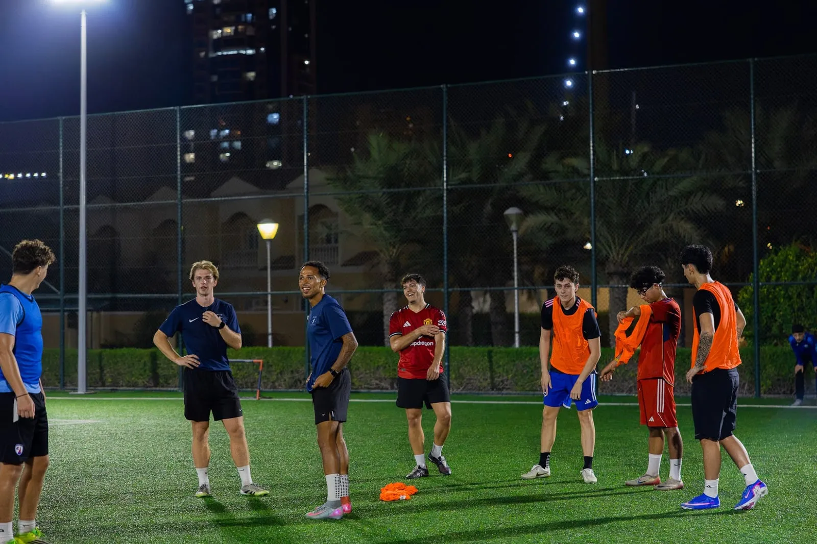 Players in a floodlit evening session